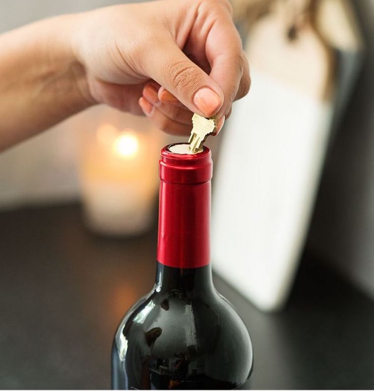 No corkscrew? Use a key to open a bottle of wine instead.