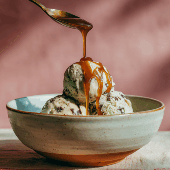 Mint chocolate chip ice cream in a bowl with salted caramel sauce showing The Science of Caramel: Stages & Technique