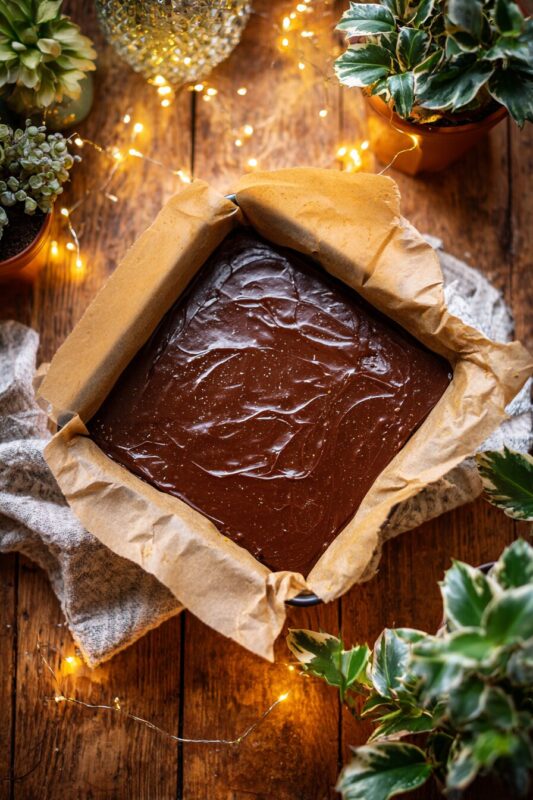 Orange chocolate fudge in tin before chilling